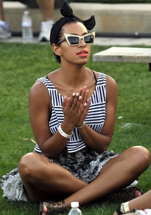 Solange Knowles hangs out a beer and some friends on Day 1 of the Coachella Music Festival in Indio, Ca